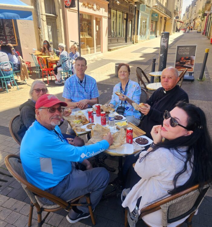 Father Clay Eating Lunch with Pilgrims