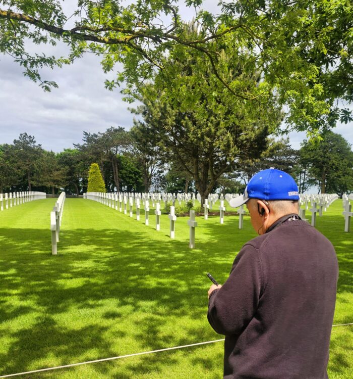 Fr. Clay stops to pray at Normandy Cemetery